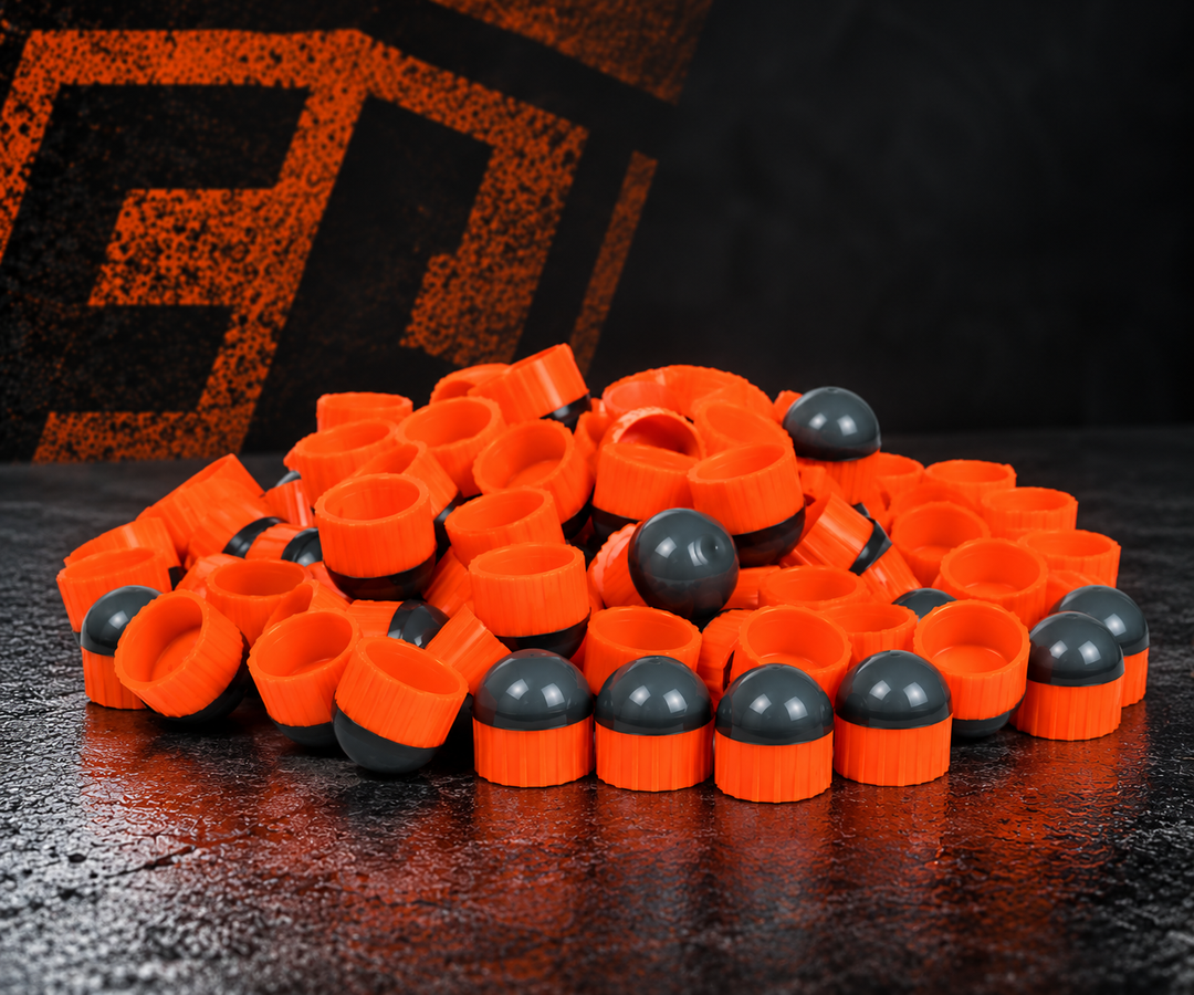 First Strike Rounds Orange with graphite-gray noses on Carmatech studio background