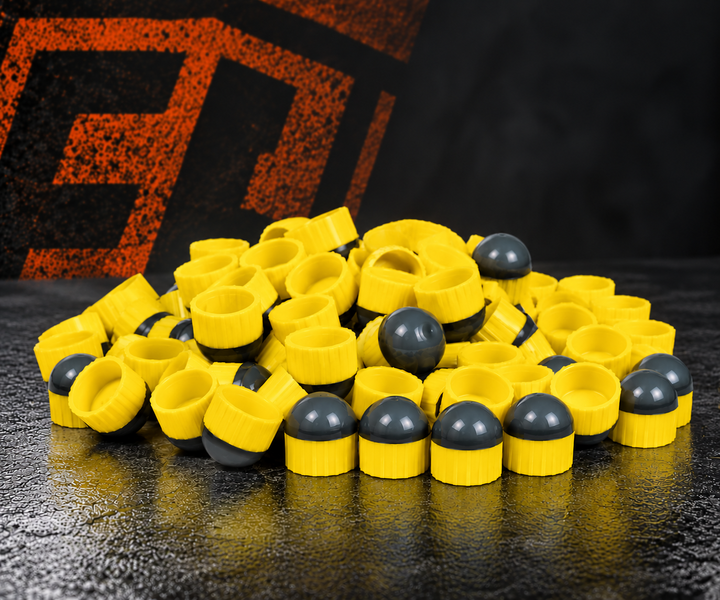 First Strike Rounds Yellow with graphite-gray noses on Carmatech studio background